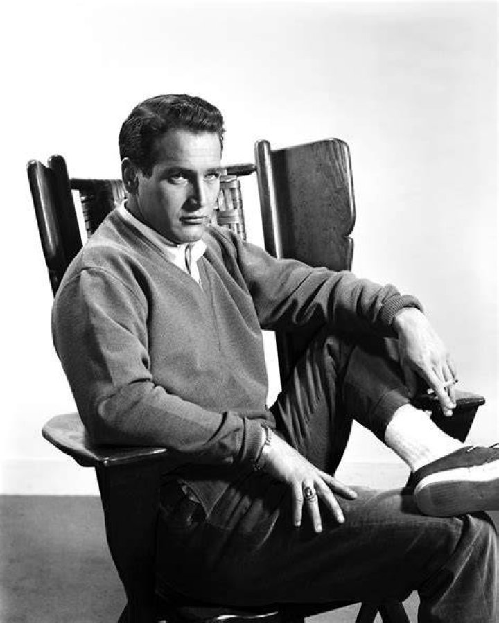 Paul Newman sitting in a red car with white interior, circa 1950. | Source: Getty Images